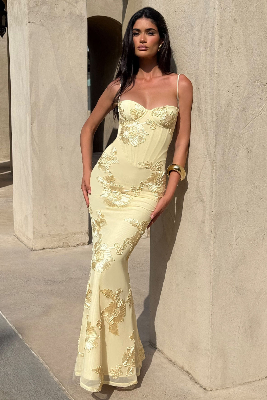 Front view cream prom dress with gold floral embroidery and thin straps