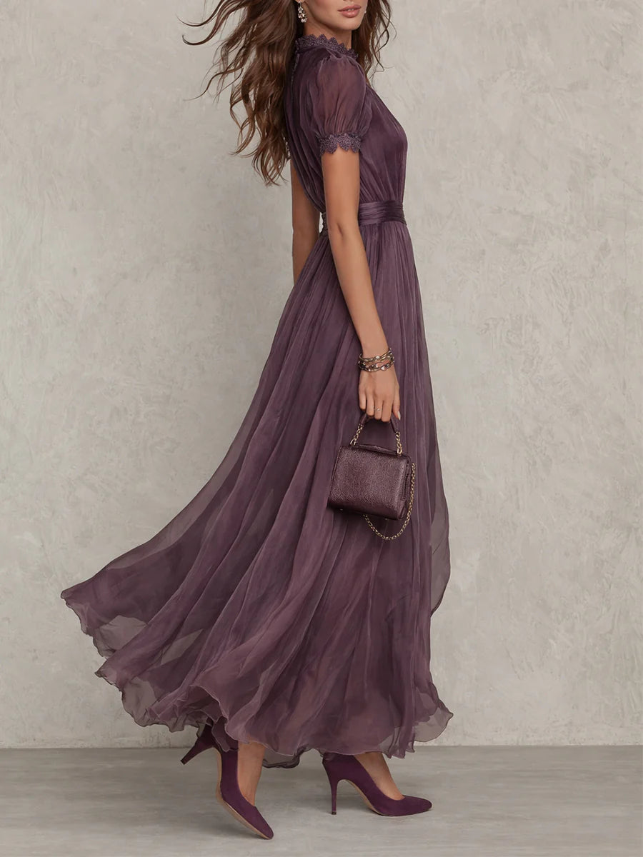 Side view of purple wedding guest maxi dress with keyhole neckline and sheer flowing skirt