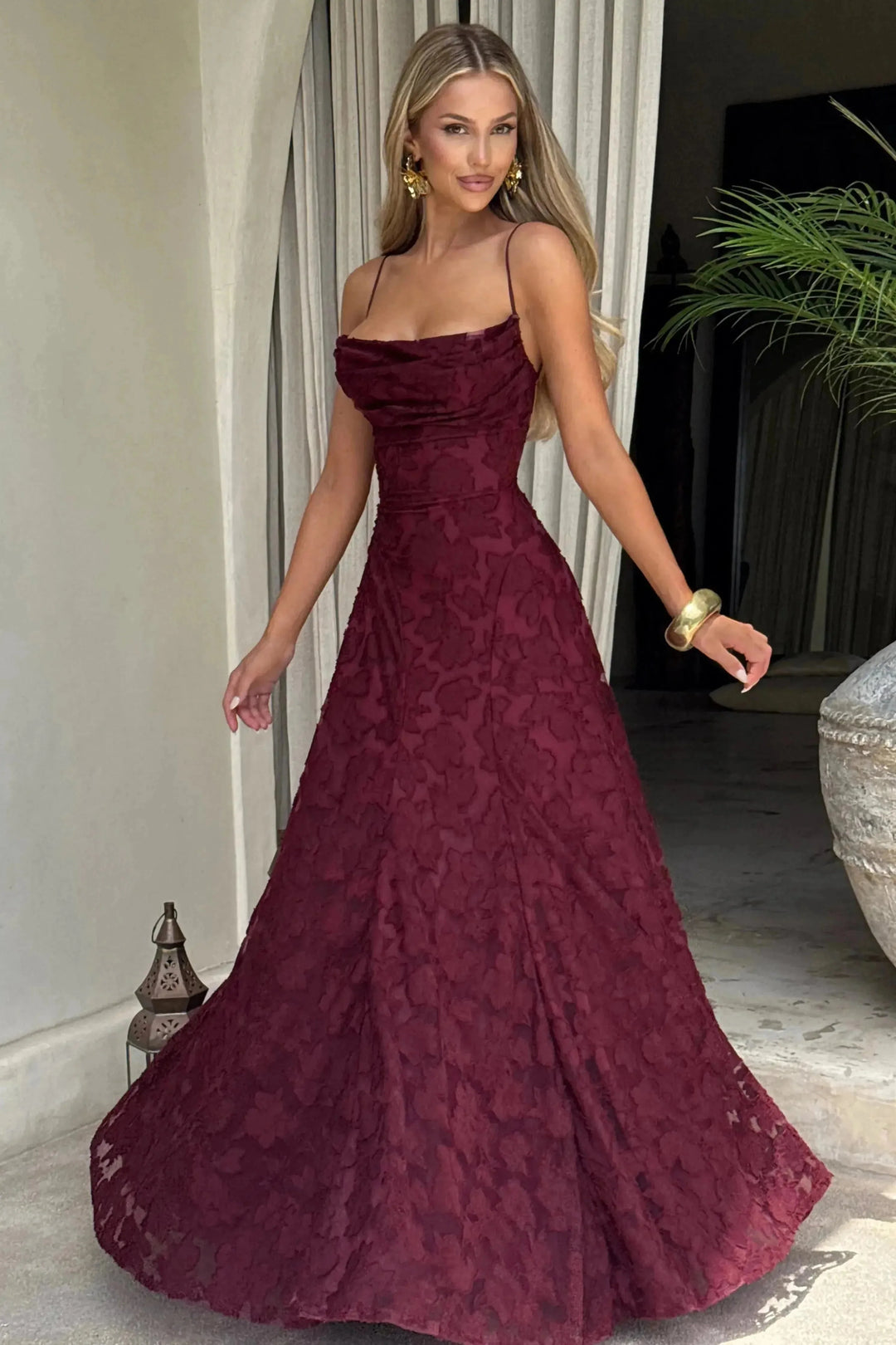 Burgundy floral lace maxi dress side view with flowing skirt