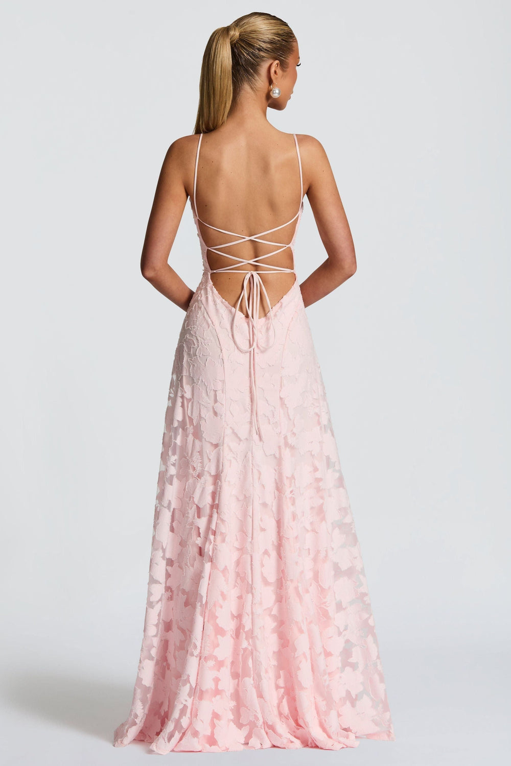 Back view of pink floral maxi dress with crisscross lace-up detail