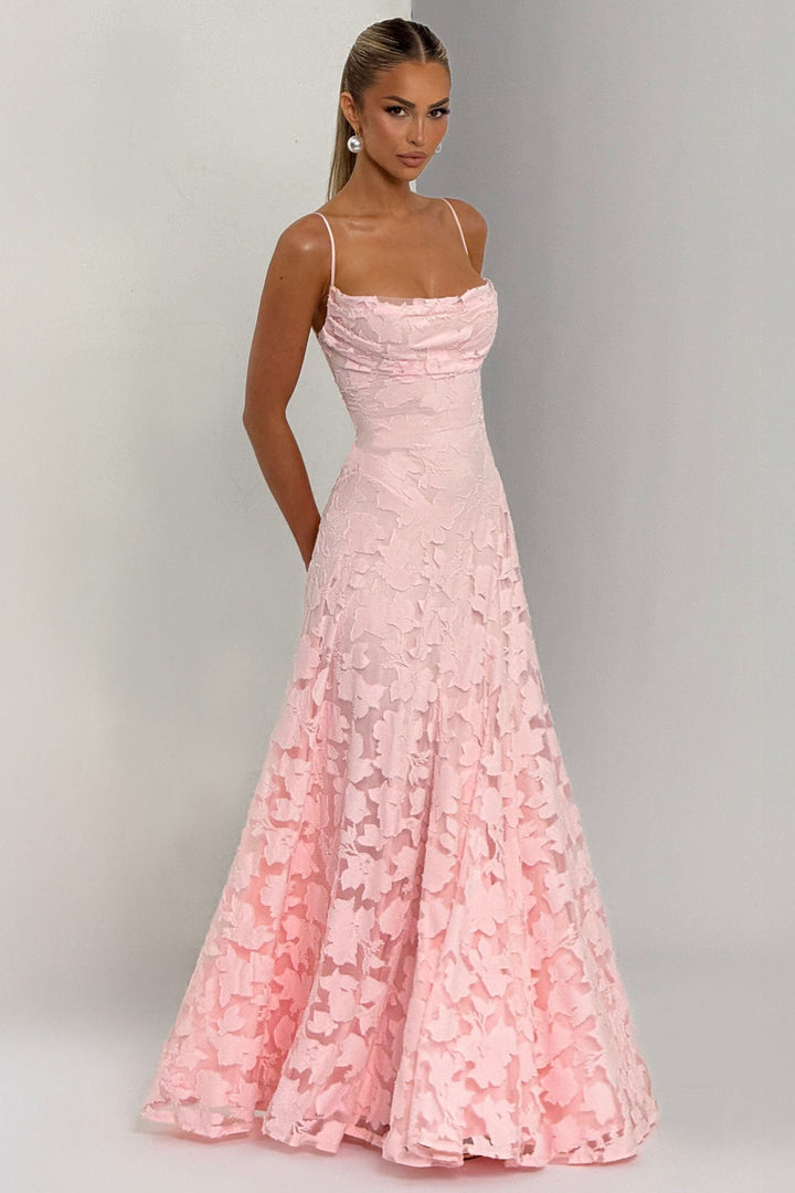 Side profile pink floral maxi dress with flowing skirt and side pockets