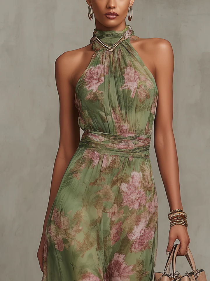 Close-up of halter neckline on green floral maxi dress with waist belt