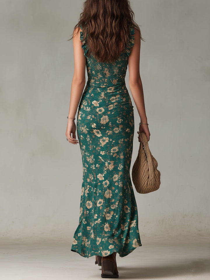 Back view of teal floral maxi dress for women with fitted silhouette and flowing hem
