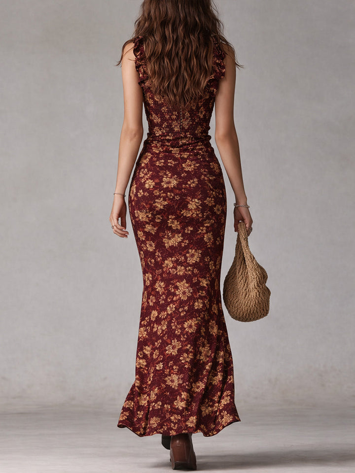 Back view of burgundy floral maxi dress with sleeveless fit and ankle-length hem
