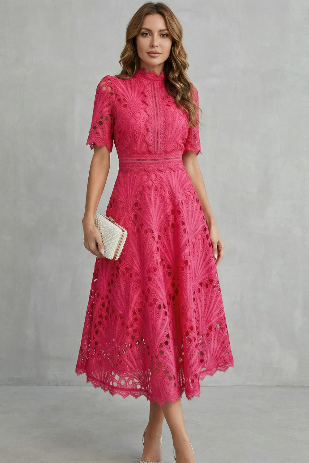 Front view of pink wedding guest lace midi dress with high neck and fitted waist