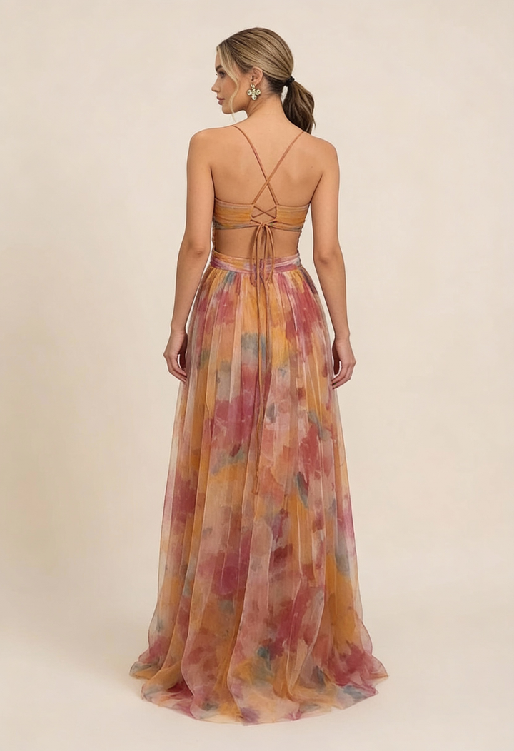Back view of watercolor floral maxi dress showing lace-up strappy back detail