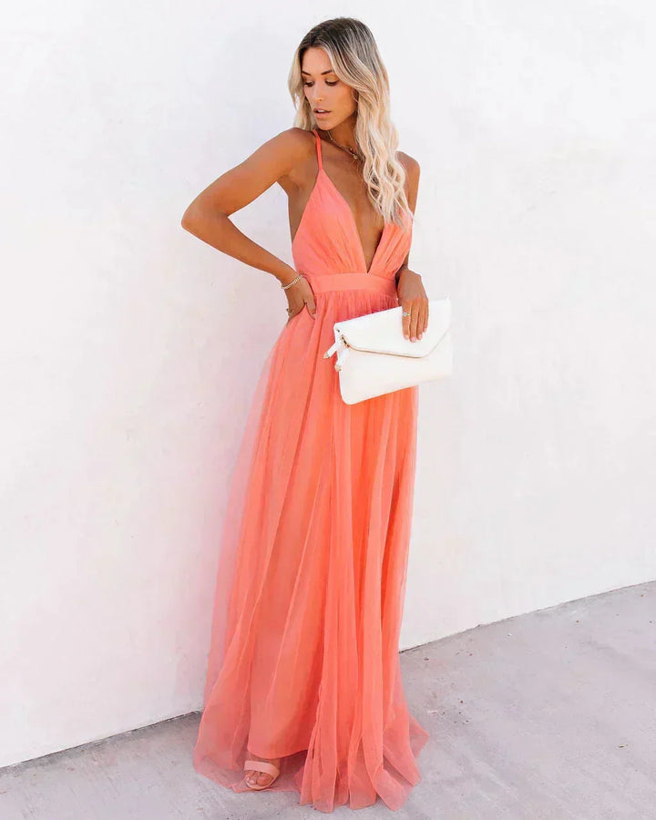 Robe longue orange fluide dos nu avec bretelles fines, idéale pour les soirées d&