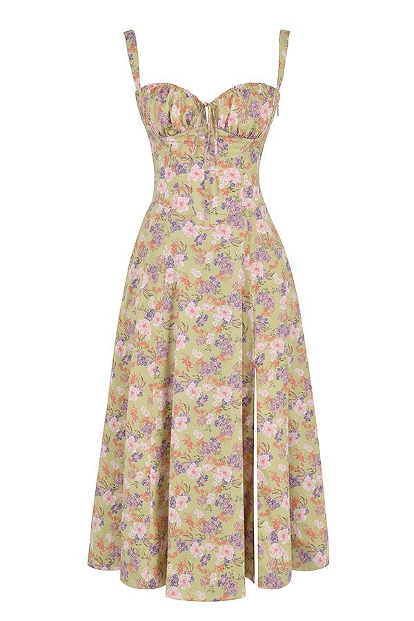 Flat lay of a green floral midi dress with pink and purple flowers, corset top, and side split.