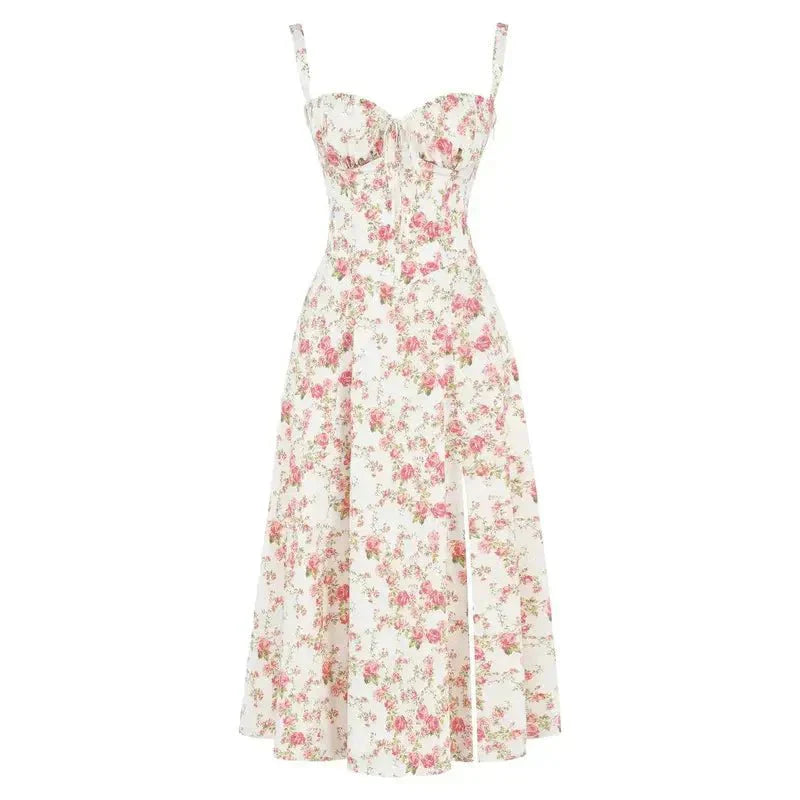 Flat lay of a white floral midi dress with pink rose print, corset design, and a side split.