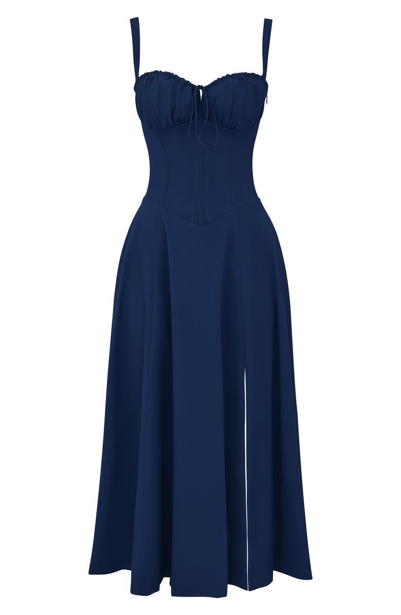 Flat lay of a navy blue midi dress with a structured corset bodice, tie-front, and a side split.