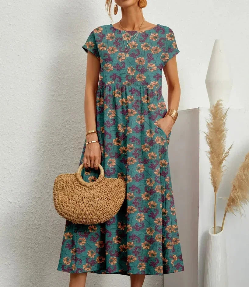 Robe midi en coton bleu avec imprimé floral, dotée de poches pratiques et d&