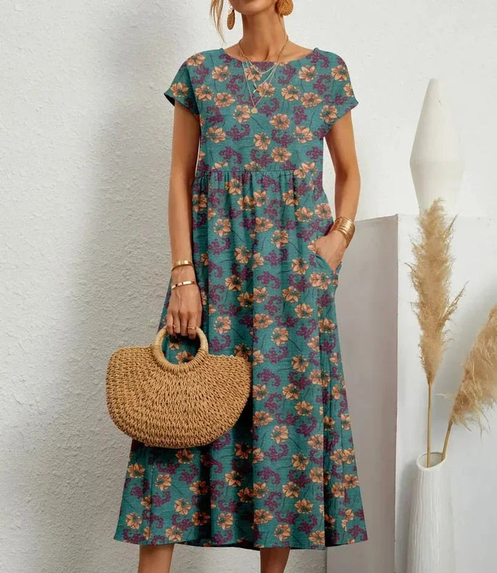 Robe midi en coton bleu avec imprimé floral, dotée de poches pratiques et d&