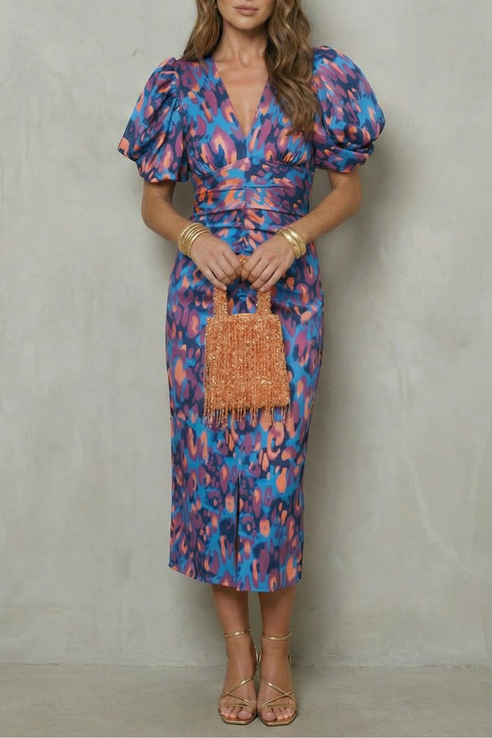 Women's abstract puff sleeve midi dress in blue and pink with deep V-neck and ruched waist