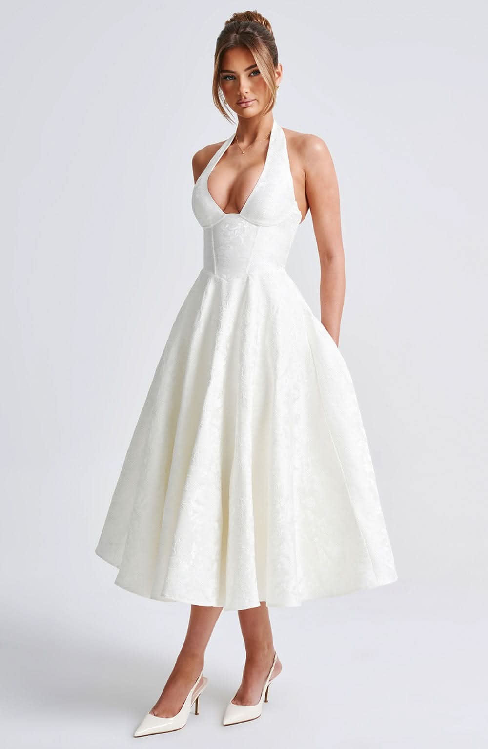 White halter midi dress with fitted bodice and full skirt