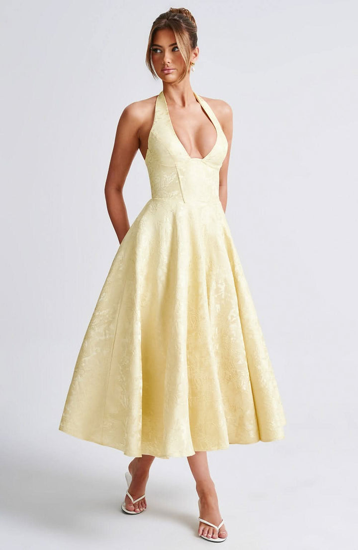 Pale yellow halter midi dress with floral jacquard and full skirt