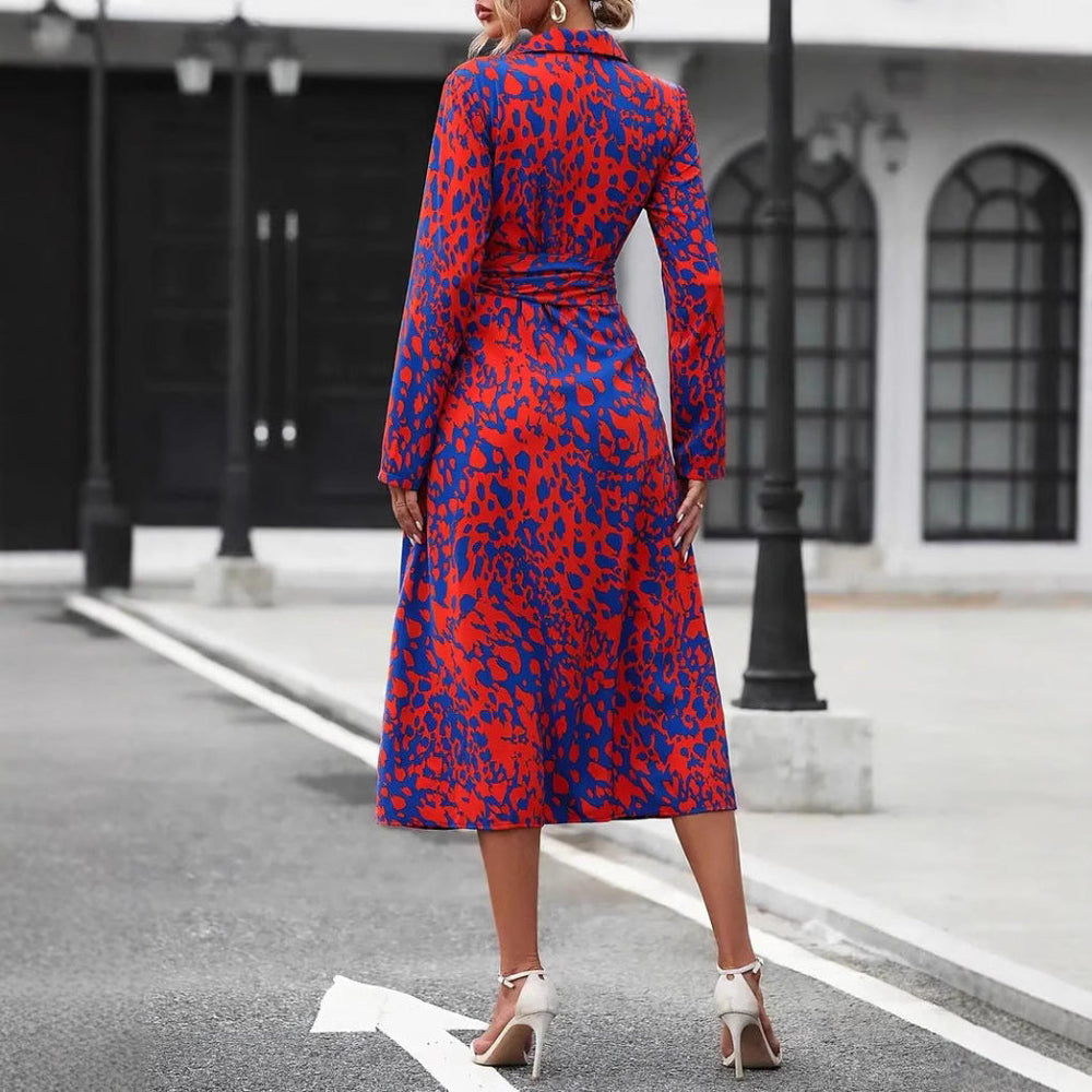 Back view of red and blue leopard print wrap midi dress with slit hem