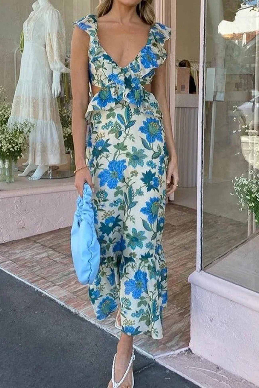 Blue floral V neck maxi dress with ruffle sleeves and side cutouts, full length view