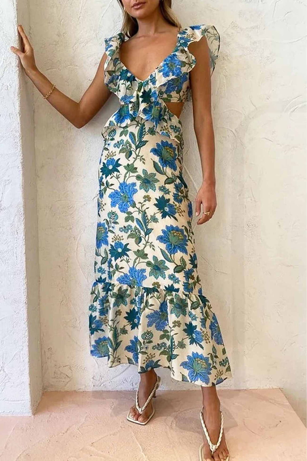 Blue floral V neck maxi dress with layered ruffle bodice and flounced hem, angled view