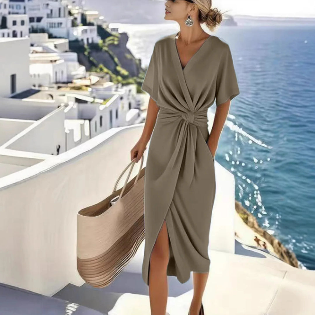 Robe midi croisée, décolleté V, taille nouée, manches courtes.